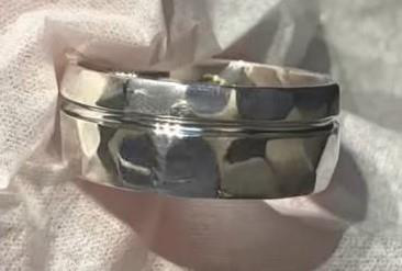Sterling silver ring with a hammered textured surface